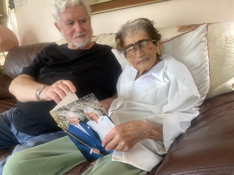 Jo Birch with husband John and her 100th birthday card from the King and Queen