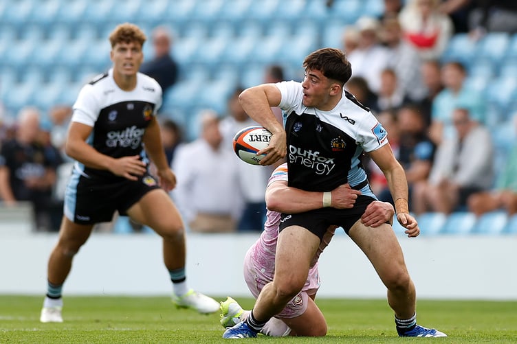 Exeter Chiefs hooker Louie Gulley looks for an offload in his side's clash with Gloucester
