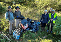 Volunteers clear litter from Bovey Tracey woodland